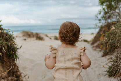 Sienna Ruffle Knit Pointelle Romper | Coastal Beige | WYLDE.