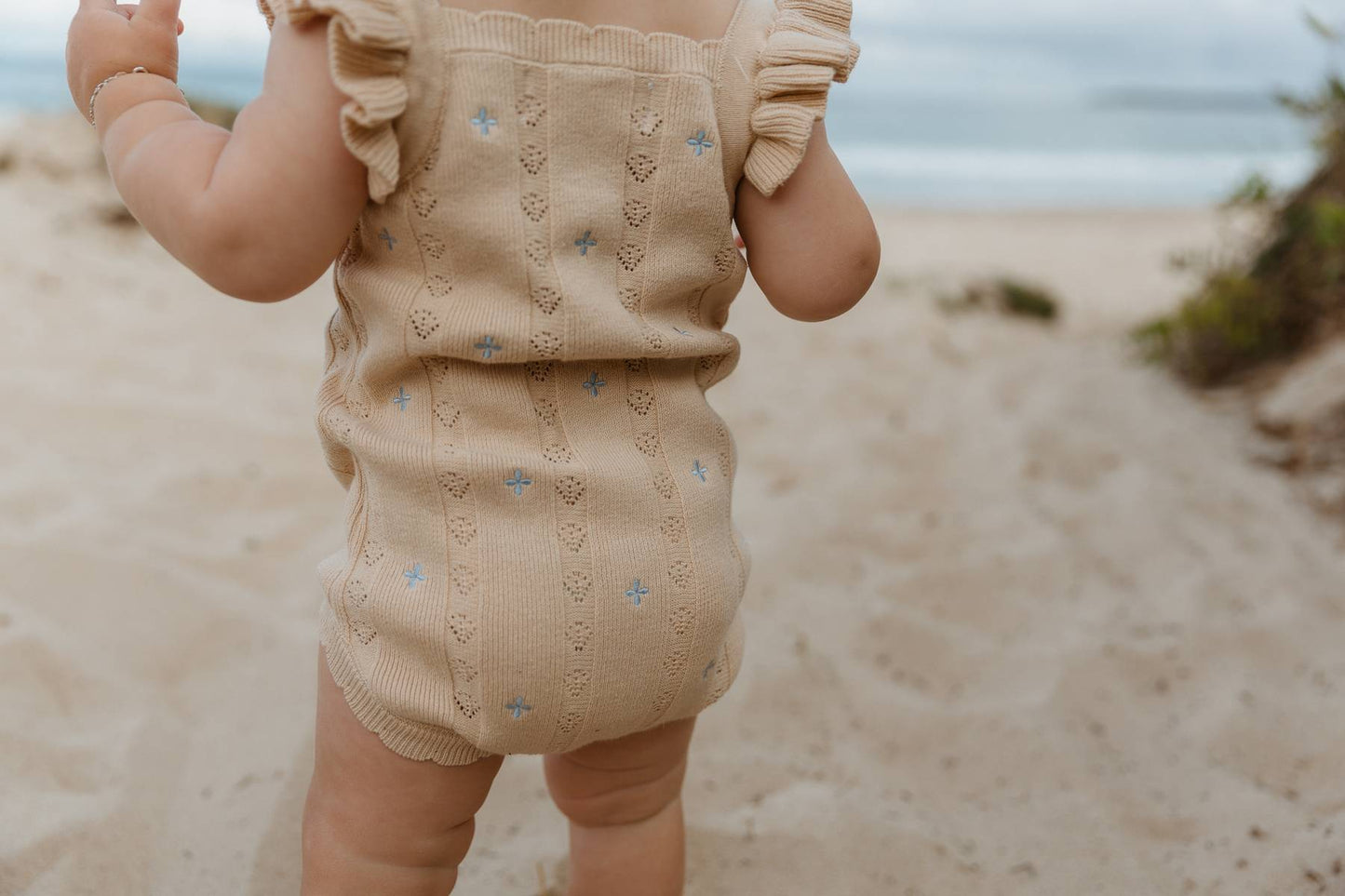 Sienna Ruffle Knit Pointelle Romper | Coastal Beige | WYLDE.