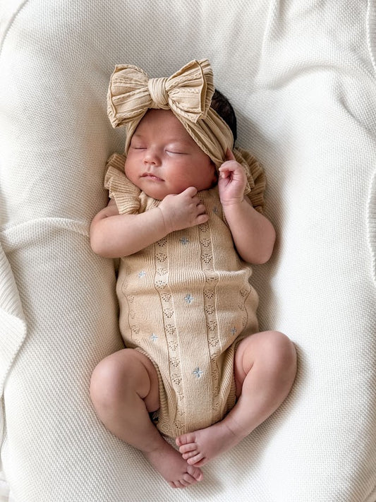 Sienna Ruffle Knit Pointelle Romper | Coastal Beige | WYLDE. Wylde. Clothing for Kids