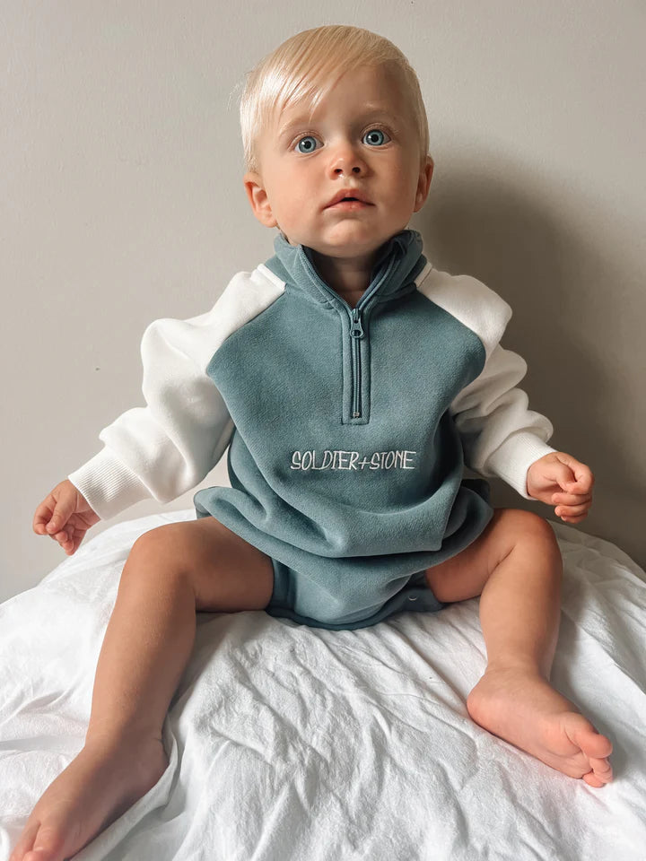 blue and white jumper romper, oversized romper with zip neck, embroidered logo and puff print soldier and stone on back